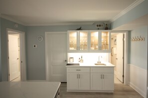 New wet bar with nice selection of glasses for your favorite cocktails.