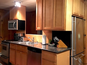stainless kitchen & granite countertops, microwave, range and fridge