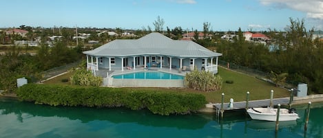 This beautiful home is on a very private setting on a wide, clear water canal.