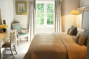 Bedroom with a super king size bed, a spacious separate dressing area and an en suite bathroom
