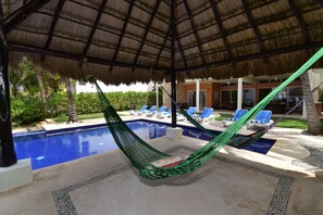 Palapa with hammocks perfect for sipping your favorite drink 