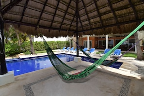 Palapa with hammocks perfect for sipping your favorite drink 