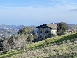 View to the Southeast from open space. To the left of our house is San Francisco