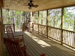 Covered porch overlooking the valley below.