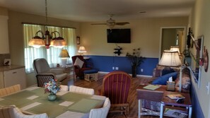 View of the living room and TV from the kitchen