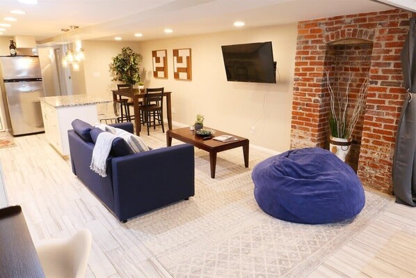 Open floor plan and mid century furnishings make for a clean yet cozy space to unwind 