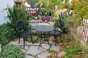Charming outside seating area is ideal for your morning cup of coffee