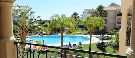 View of the Pool and lawns from balcony.