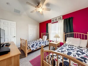 Twin bedroom with bright decor, perfect for kids or additional guests.