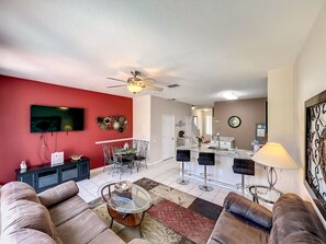 Open-concept living and dining area with modern furnishings and natural light.
