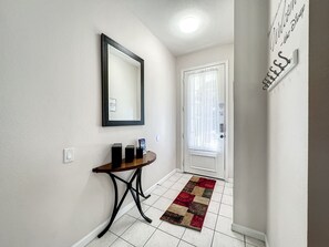 Welcoming entryway with modern decor and plenty of natural light.
