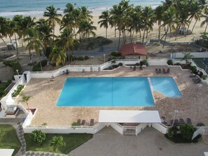 View of swimming pool from balcony.