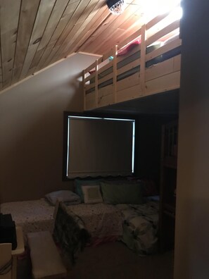 second bedroom with large loft sleeping area above