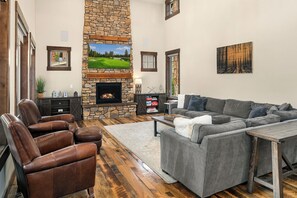 Living room with extra large sectional and leather chairs for relaxing.