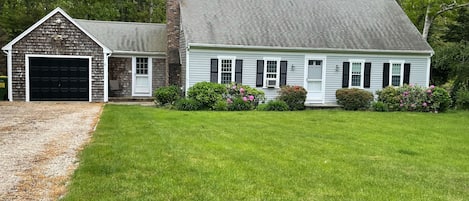 Large front yard and parking for 4 cars in driveway. 