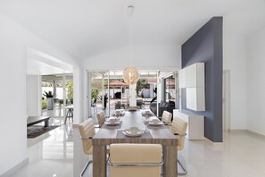 Dining area with access to the backyard with glass sliding doors