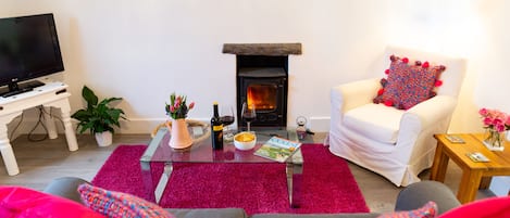 The living room with log burning stove for cosy nights in