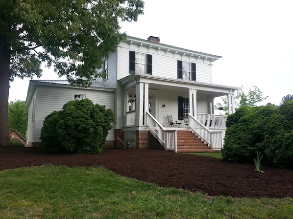 The front view before a wedding ceremony in the side yard.