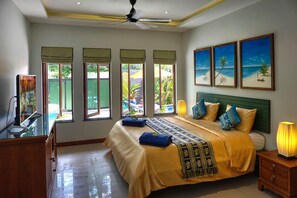 Bedroom with air conditioning and large overhead fans