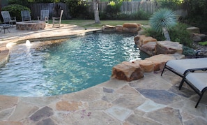 River-like pool with , firepit and plenty of space to float and lounge.