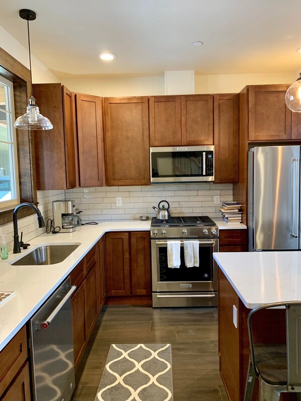 Gorgeous kitchen with pots, pans, coffee maker, crock pot & more! 