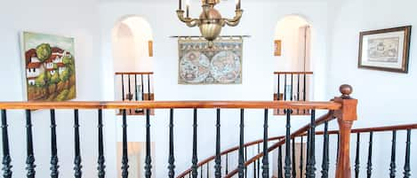 Beautiful ceadar stair case leading down to the lower level of the home