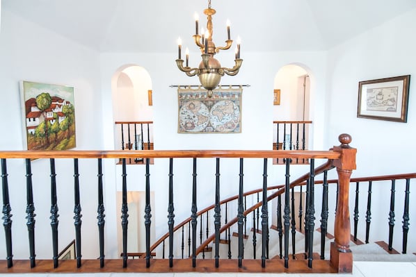 Beautiful ceadar stair case leading down to the lower level of the home