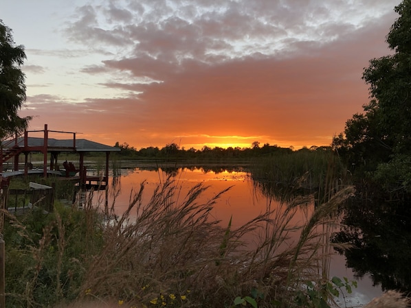 Watch the sun set over Lake Huntley from your backyard