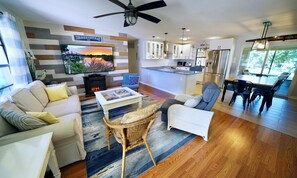 Open concept living room with 75" Sony Bravia TV with Chromecast and Roku