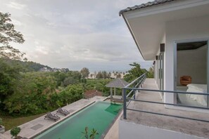 Balcony view of the pool and ocean.