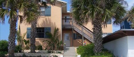 Exterior Front - Direct Ocean Front - porch in front & large covered back deck.