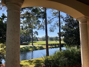 Back covered patio overlooking the golf course lake