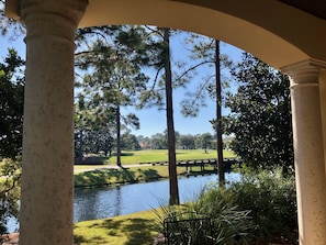 Back covered patio overlooking the golf course lake