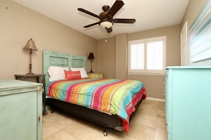 The middle bedroom has one queen
