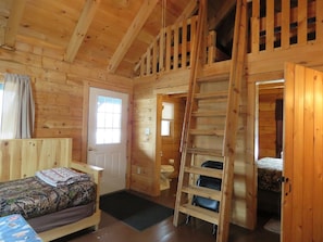 view of loft, daybed, bathroom