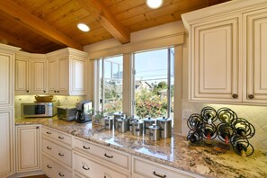 Kitchen with basic needs, flour, sugar, spices, coffee...except for the wine