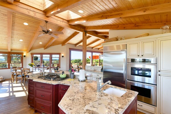 Kitchen and dining room. Chef still has an ocean view!