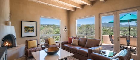 Living room with amazing views and gas kiva fireplace