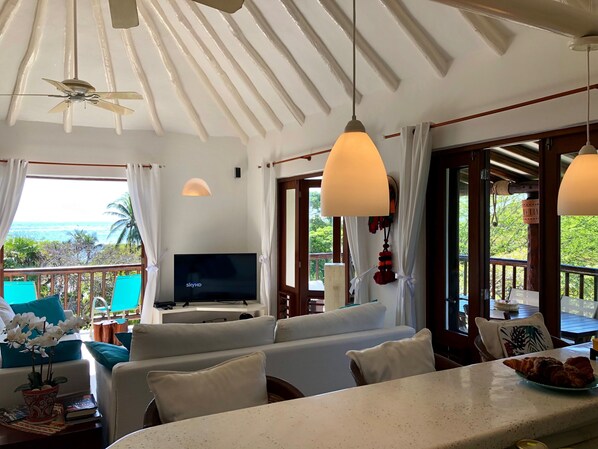 Main living space with the beach in front. You can see it in the window :)