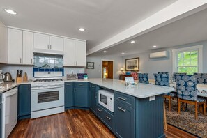 Remodeled kitchen with breakfast bar offers plenty of seating