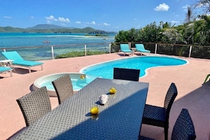 Your sun deck, pool and outside dining area at the Rainbow Beach House