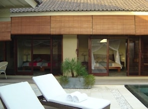 Patio sunbeds and view of both bedrooms
