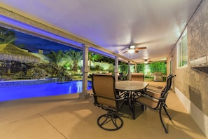 Large covered patio w/ceiling fans, dining & lounging areas,  natural gas grill.