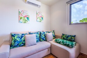 L shape queen pull out sofa in the living area for a possible 3rd guest