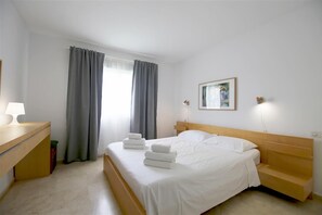Master bedroom with king-size bed and en-suite bathroom