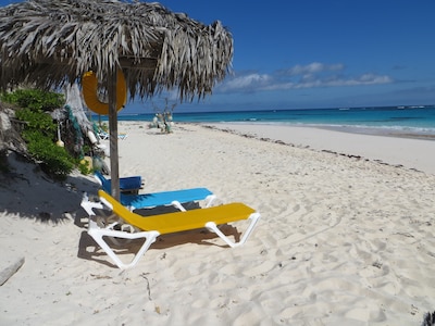 Beach palapa on the soft warm sand awaits you!