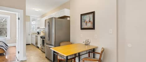 Beautiful kitchen with new stainless steel appliances and quartz countertop.