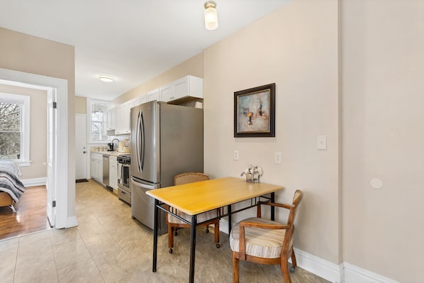 Beautiful kitchen with new stainless steel appliances and quartz countertop.