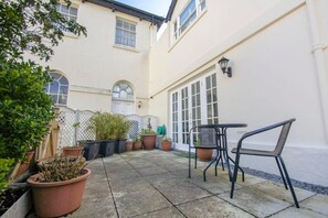 Outside Space
A patio area is located off the living room with seating to enjoy your meals al fresco!