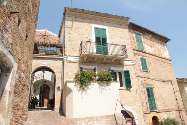 House facade with courtyard and terrace